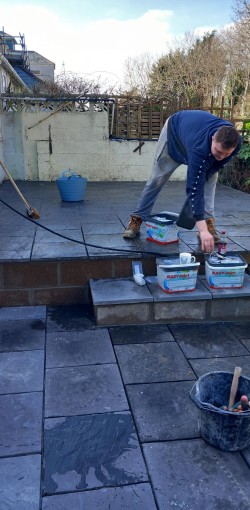 Customer had old slippery decking. We demolished it and built retaining wall and laid new patio slabs.