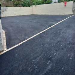 Preparation for constructing a block wall and a tarmac driveway complete with cream colour edging