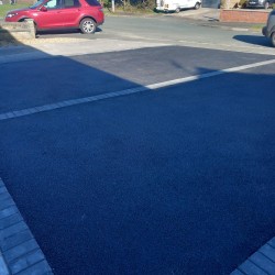 Finished tarmac driveway, complete with charcoal black boarder