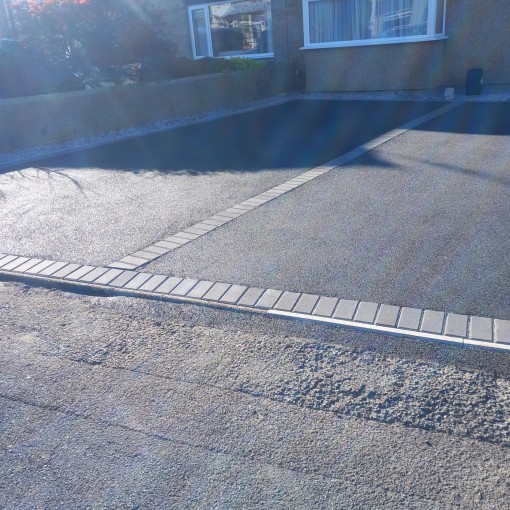 Finished tarmac driveway, complete with charcoal black boarder